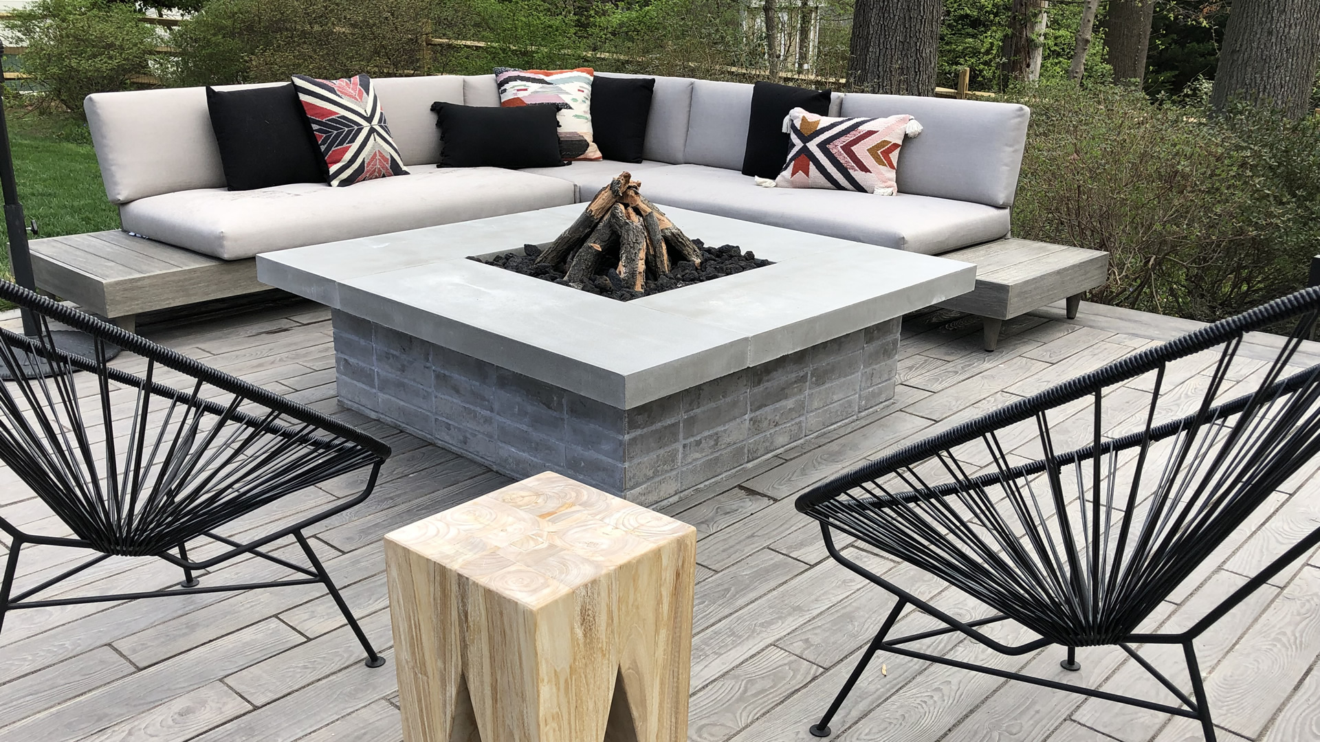 a fire pit sitting on top of a wooden deck