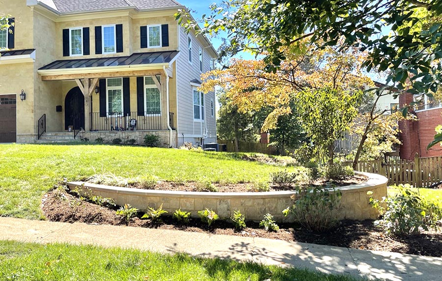 A lawn with brick retaining walls in a semicircle