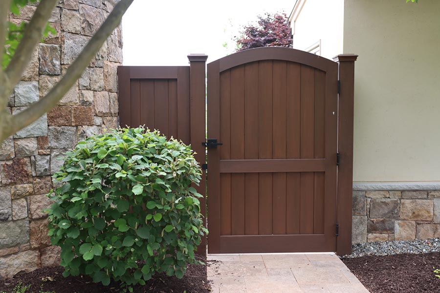 A dark brown wooden fence