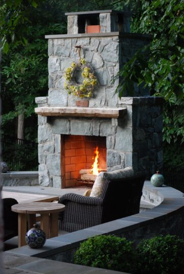 A wood-burning outdoor fireplace from Outdoor Spaces