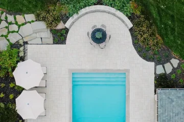 Patio with a pool, lounge chairs, and dining area