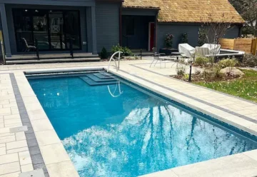 A pool with a paver border