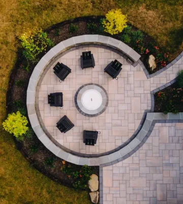 Circular patio firepit section with retaining seat wall